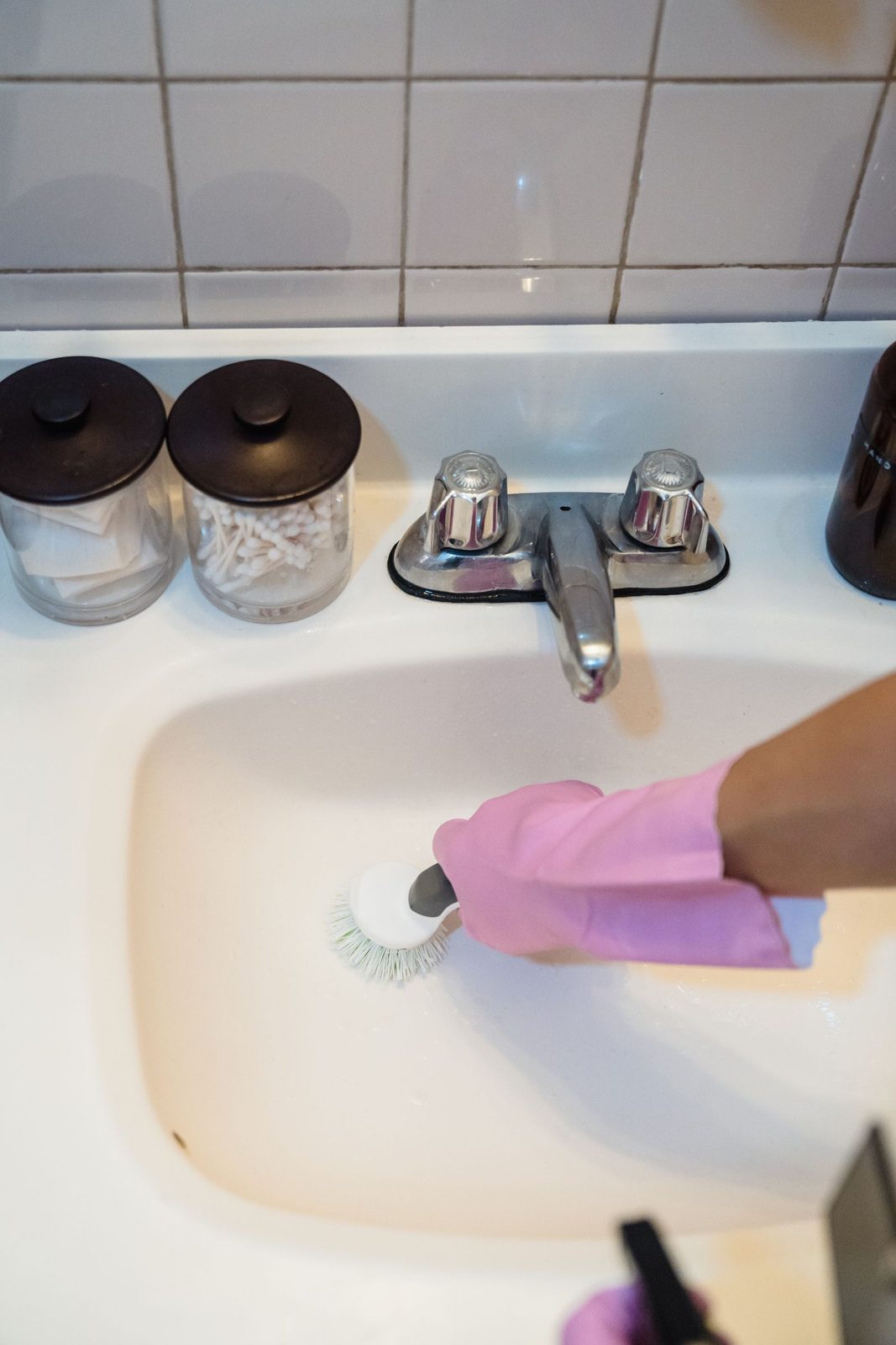 Scrubbing a bathroom sink