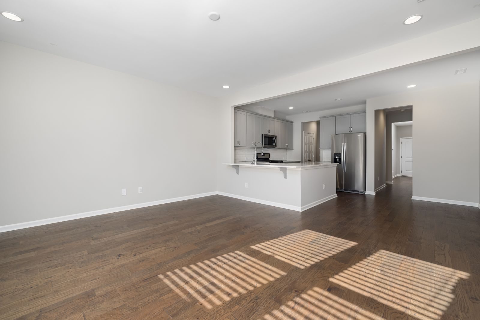 Empty living room with clean wood floors