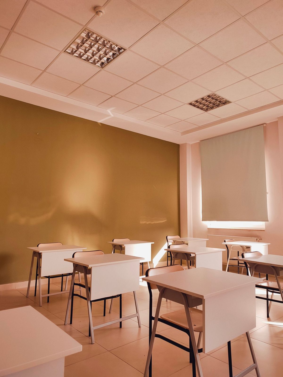 Tidy classroom with white desks